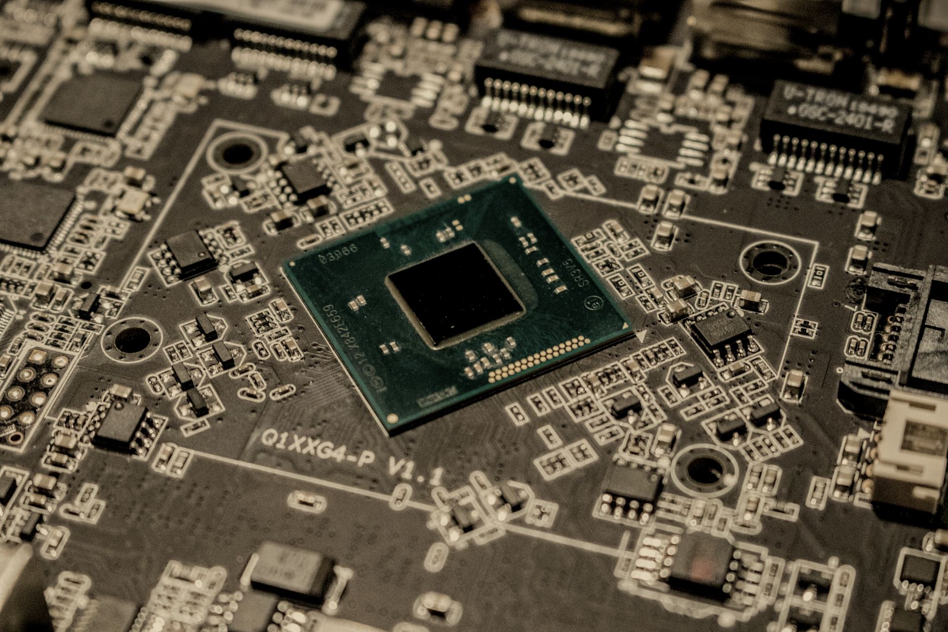Bare processor die on a dark logic board
